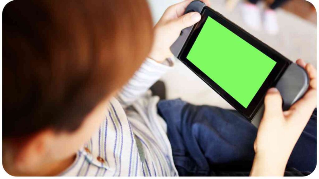a person playing with a video game on a tablet with a green screen