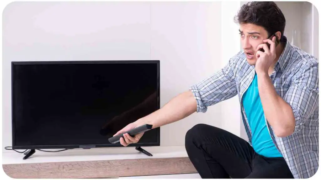 a person talking on the phone while holding a remote control